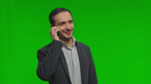 Caucasian Happy Man Talking on Cell Phone Isolated on Grey Background