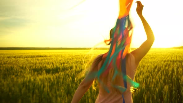 Girl Running Around with a Kite on the Field.