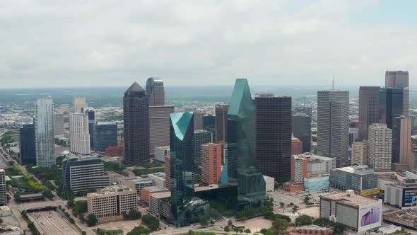 Forwards Reveal of Modern Tall Buildings at Fountain Place with Glass Facades and Irregular Shape