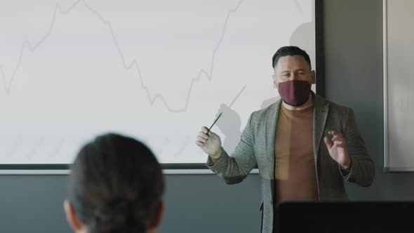 Businessman in Face Mask Delivering Presentation