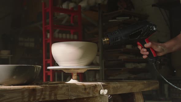 Raw Clay Pot Is Being Dried By Dryer