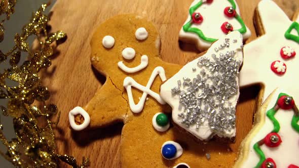 Sweet food and gingerbread on wooden plank