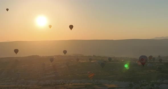 Aerial Cinematic Drone View of Colorful Hot Air Balloon Flying Over Cappadocia