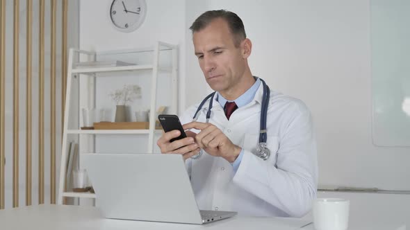 Doctor Using Smartphone for Internet