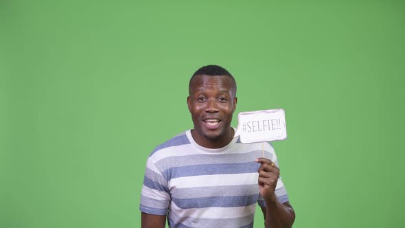Young Happy African Man with Selfie Paper Sign