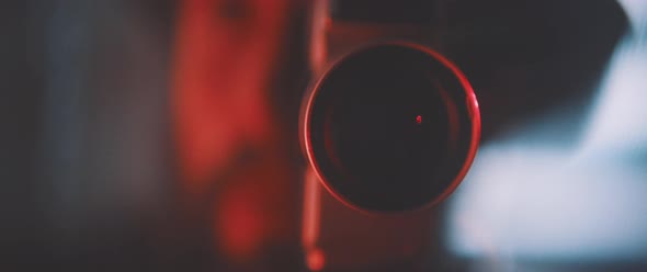 Close up of vintage camera lens in red light