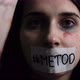 A young female victim of violence raises her head and shows the word "metoo" on her face - VideoHive Item for Sale