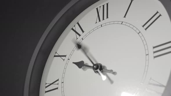 Latin Clock Face In Time Lapse On Dark Grey Wall 