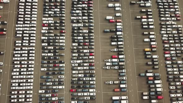 Many new and occasion Cars on a huge parking lot waiting for shipment, Aerial