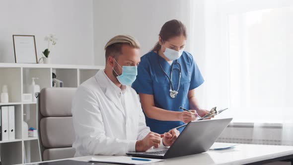 Professional medical doctors working in hospital office. Physician and the young nurse.