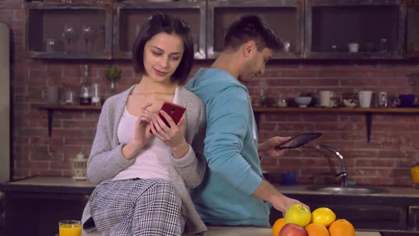 Couple in Love Have Breakfast with Modern Device