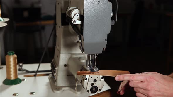 Craftworker Sewing Leather on Machine