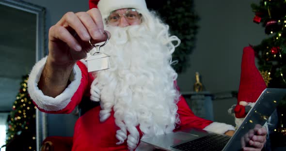 Portrait Santa Claus Holding Car Keychain Close Up