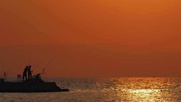 Evening Scene of Sea and Fishermen on the Pier