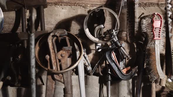 Village Workshop. A Variety of Hand Tools Are Hung on the Log Wall.