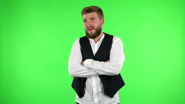 Man Is Upset Talking To Someone, Looking Away. Green Screen