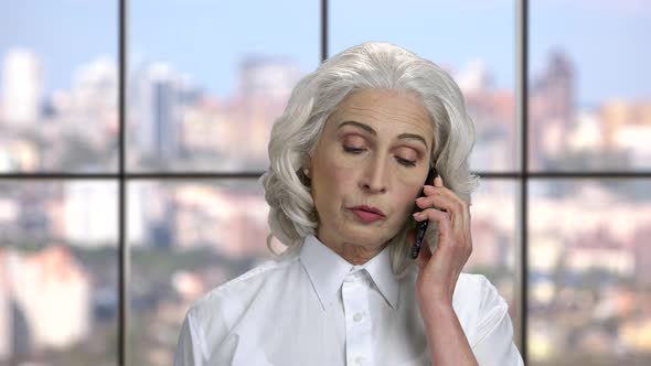 Mature Business Woman Talking on Cell Phone