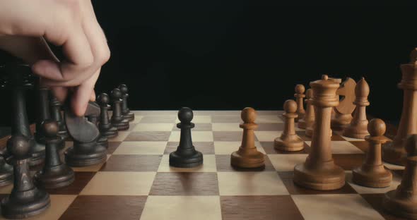 Confident Business Colleagues Playing Chess Game Isolated on Black Background