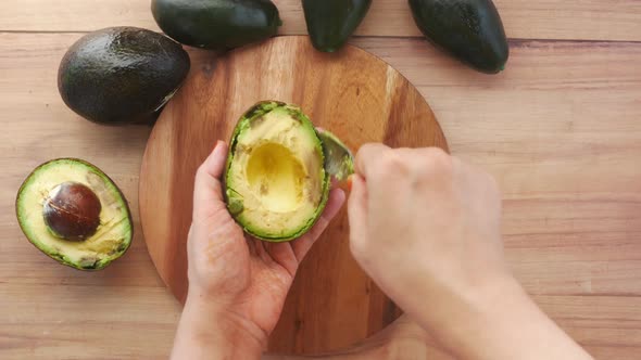 Close Up of Slice of Avocado on Women's Table