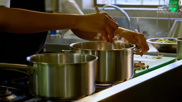 Chef preparing food in kitchen at restaurant 4k