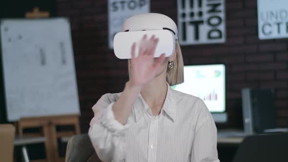 Business Woman Working in Cyberspace in Office. Woman Designer Using VR Glasses.