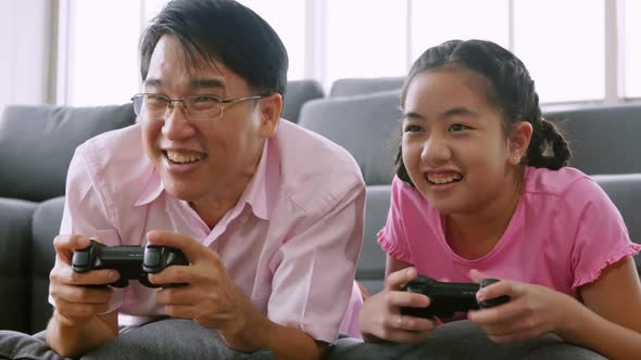 Happy family with father and daughter spending time together at home.