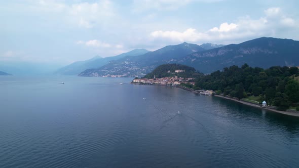Aerial Flying Over Calm Waters Of Lake Como In Bellagio. Circle Dolly