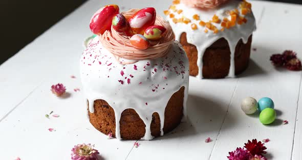 Easter cake with chocolate eggs decoration, on white wooden table