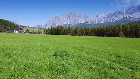 Walking on the Valley with View on the Dolomites Mountains in Italy