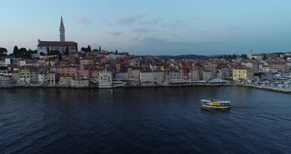 Aerial view of a boat sailing in the harbour in Rovinj, Croatia.