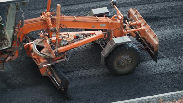 Road works with an asphalt paver. Special road equipment