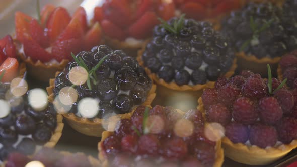 Top Close Up of Fresh Berry Tartlets in Bakery
