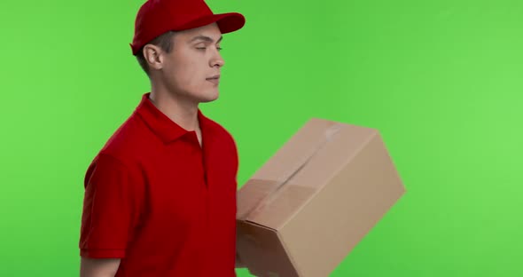 Courier Coming in with Parcel and Smiling at Camera