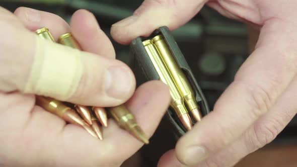 Cartridges Charge. Close-up. Slow Motion