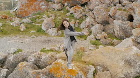 Girl is playing by the lake Summer Baikal lake Olkhon island