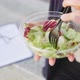 Close up of businesswoman eating salad on lunch break - VideoHive Item for Sale