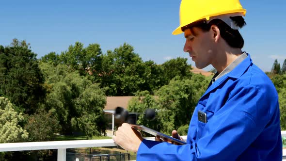 Male worker working at solar station 4k