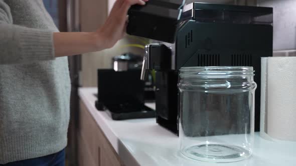 Girl Collects Coffee Grounds for Recycling