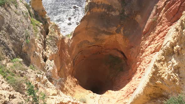 Hole in a cliff on the seashore