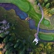 Aerial View of Golf Course Near the Forest - VideoHive Item for Sale