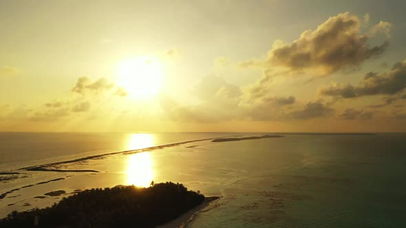 Aerial drone shot seascape of paradise shore beach holiday by aqua blue ocean and white sand backgro