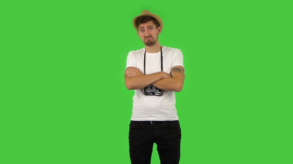 Confident Guy Is Listening Attentively and Nodding His Head Pointing Finger at Viewer, Green Screen