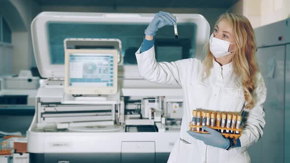 Portrait of a Lab Worker with Blood Sampling Tubes in Her Hands. Laboratory for the Study of