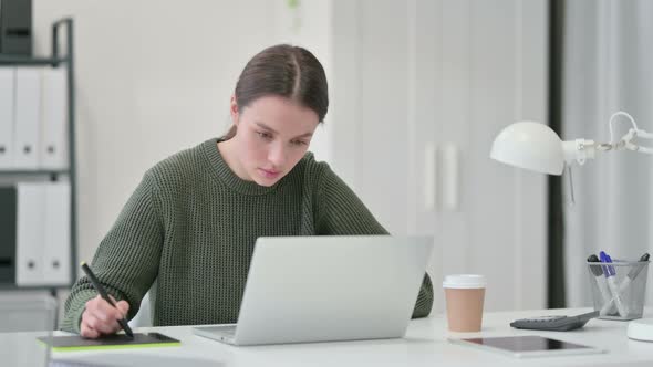 Young Woman Using Graphic Tablet, Designing