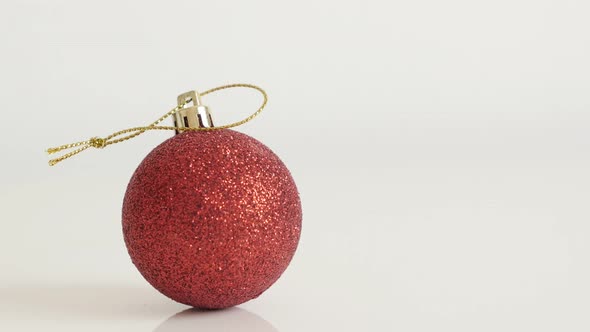 Close-up of decorative  red bauble with sequins  4K 2160p 30fps UltraHD tilting  footage - Shiny Chr