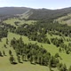 Green Meadows in The Sparsely Wooded Between Forest Covered Hills with Aerial View - VideoHive Item for Sale