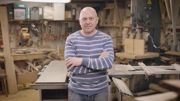 Portrait of an Elderly Man in a Carpentry Workshop