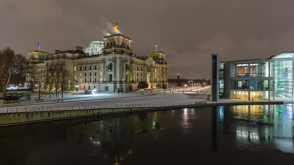 Snowy Night Time Lapse of Reichstag Building with Spree River, Berlin, Germany