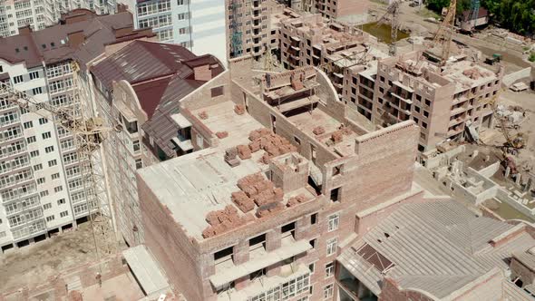 Aerial Drone View of Construction Building in City. Workers Work on Construction Sites Top View  alt
