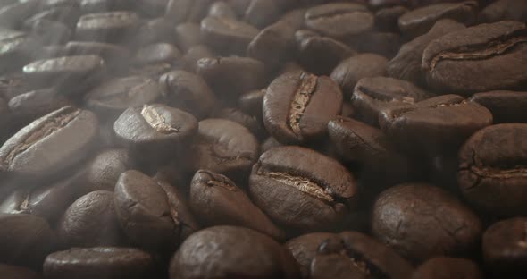 Macro Shot Roasting Coffee Beans Filmed in a Dark Key the Smoke Emanating From the Roasting of